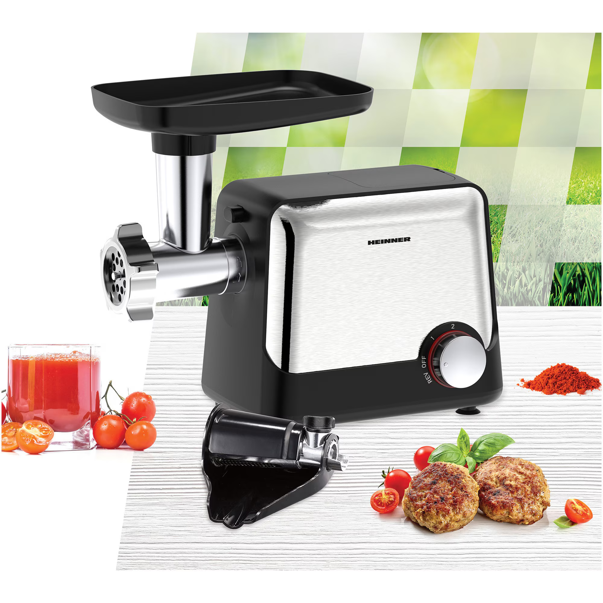 A meat grinder with accessories, tomato juice, and patties.