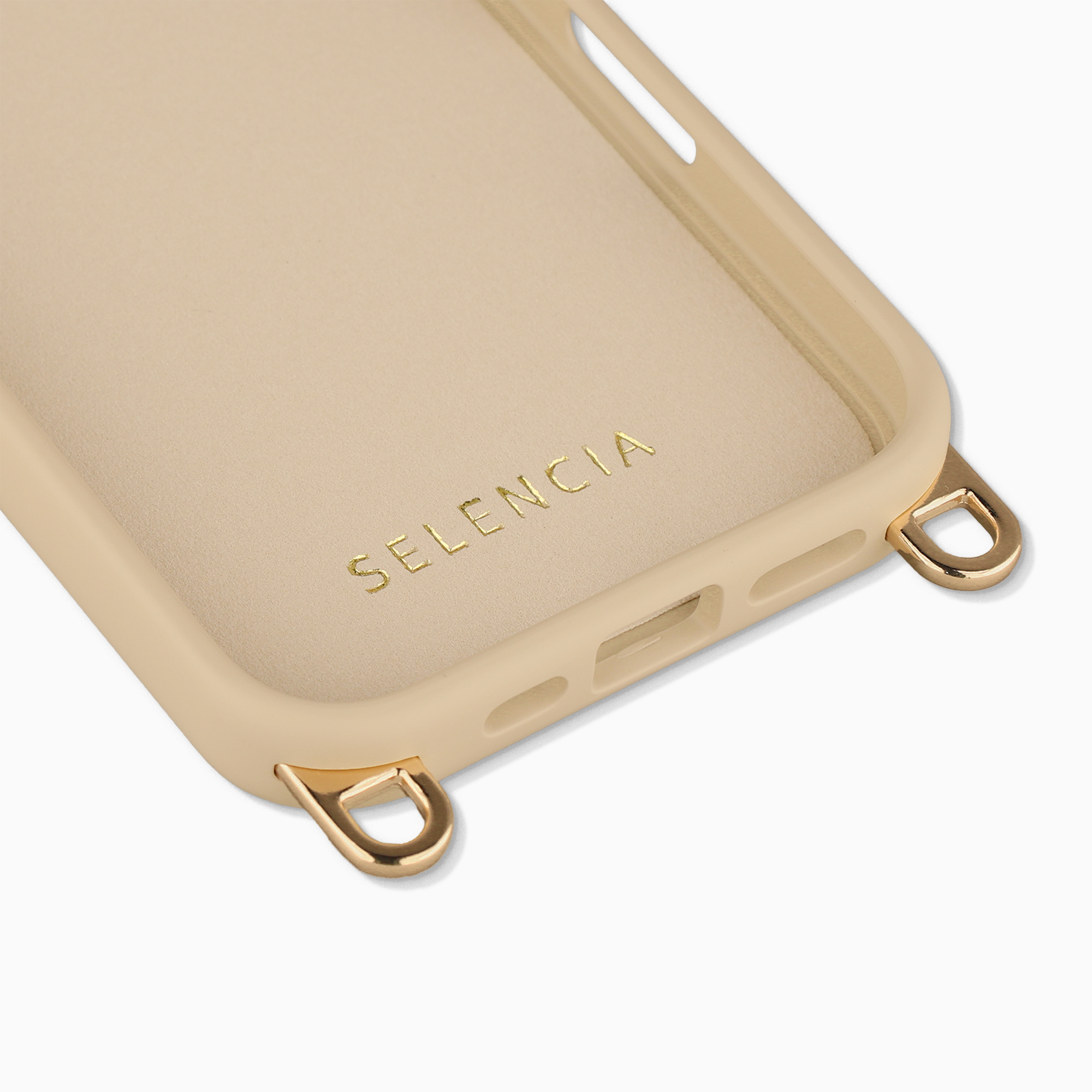 Eine beige Handyhülle mit goldenen Beschlägen und dem Schriftzug SELENCIA.