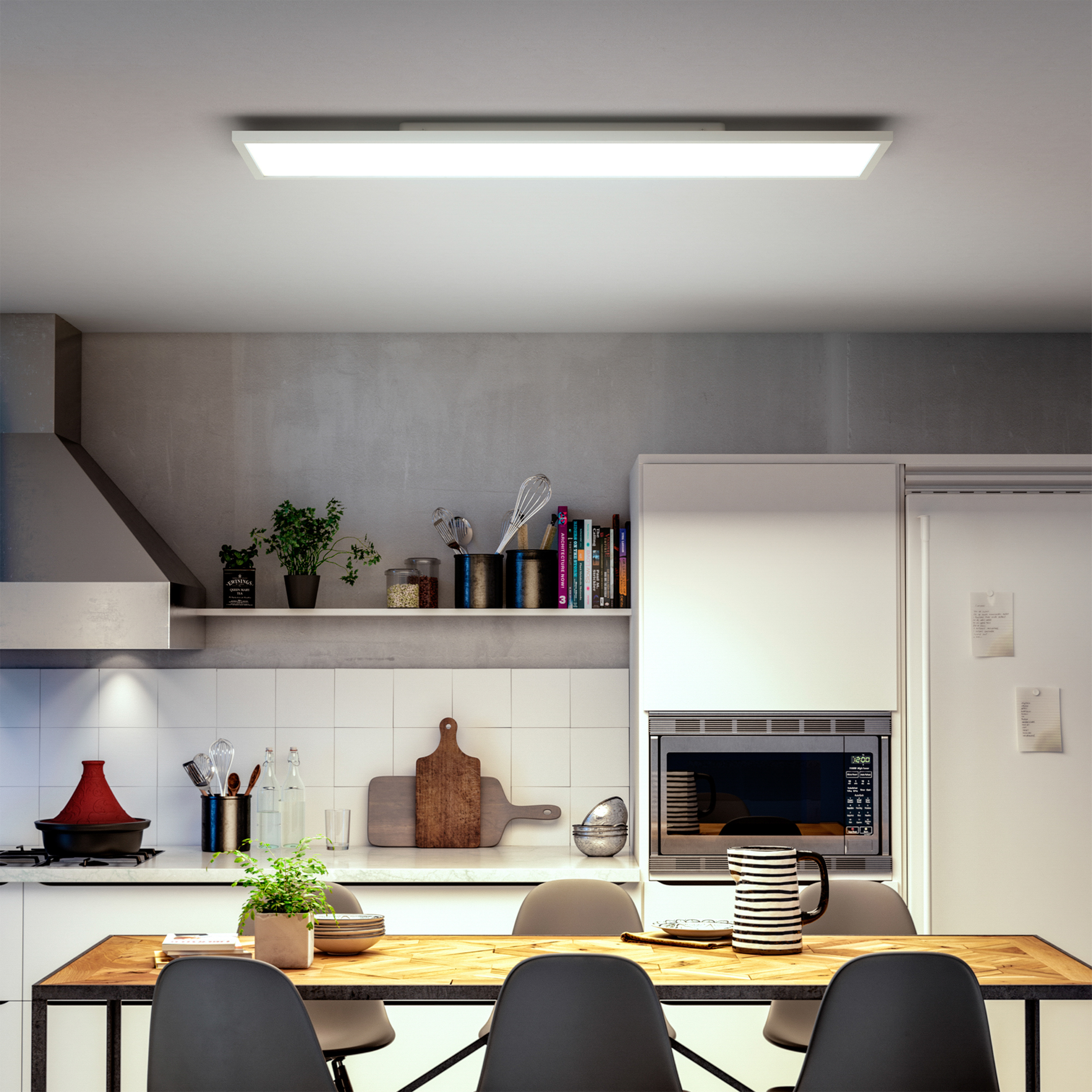 Moderne keuken met eettafel, magnetron, plank en fornuis.