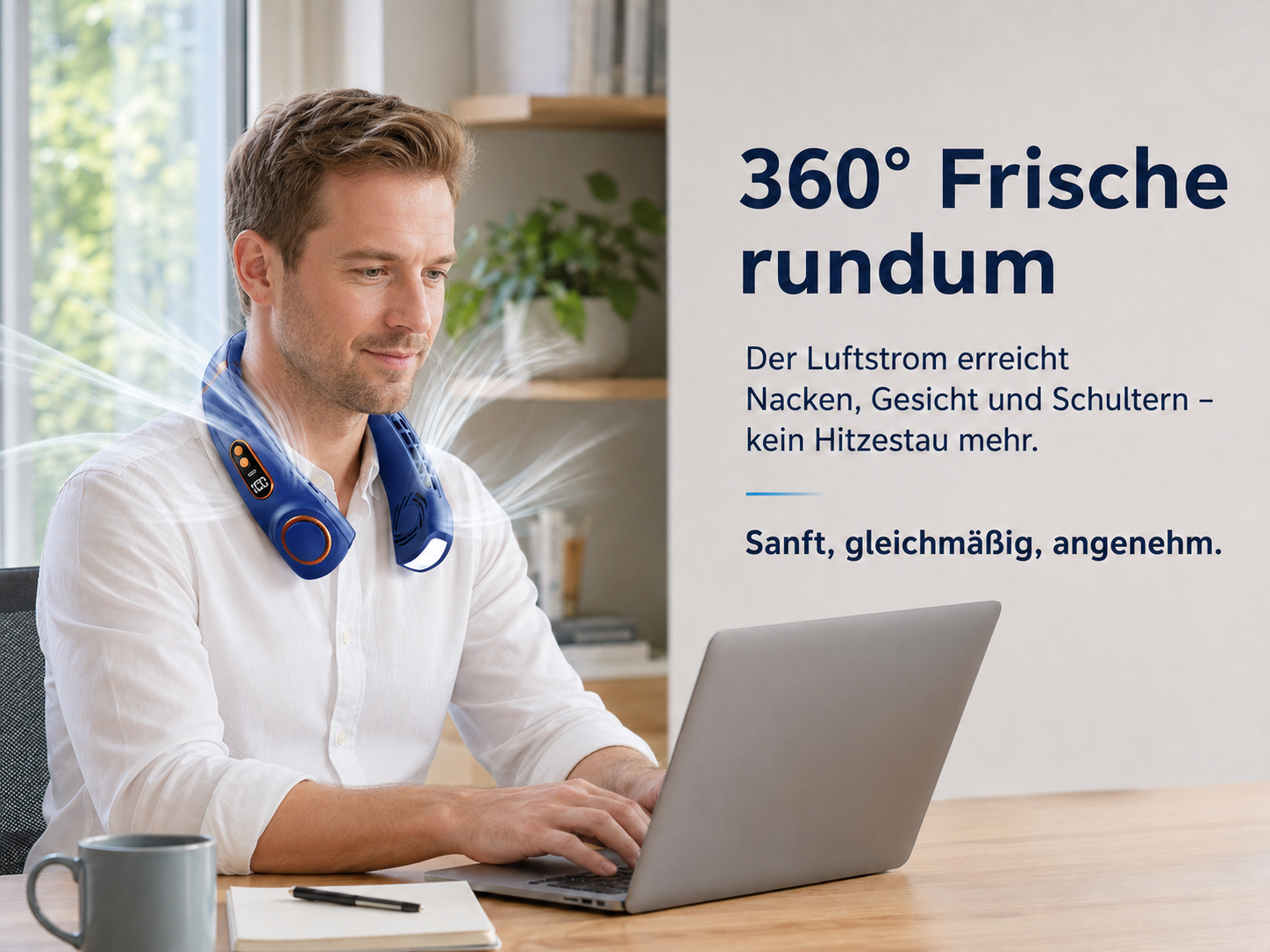Mann mit blauem Nackenventilator, der auf einem Laptop tippt.