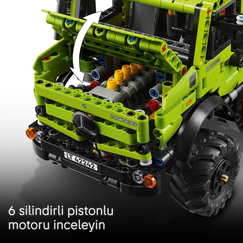 Açık kaputlu yeşil Lego Unimog, detaylı motor ve sarı pistonları gösteriyor.