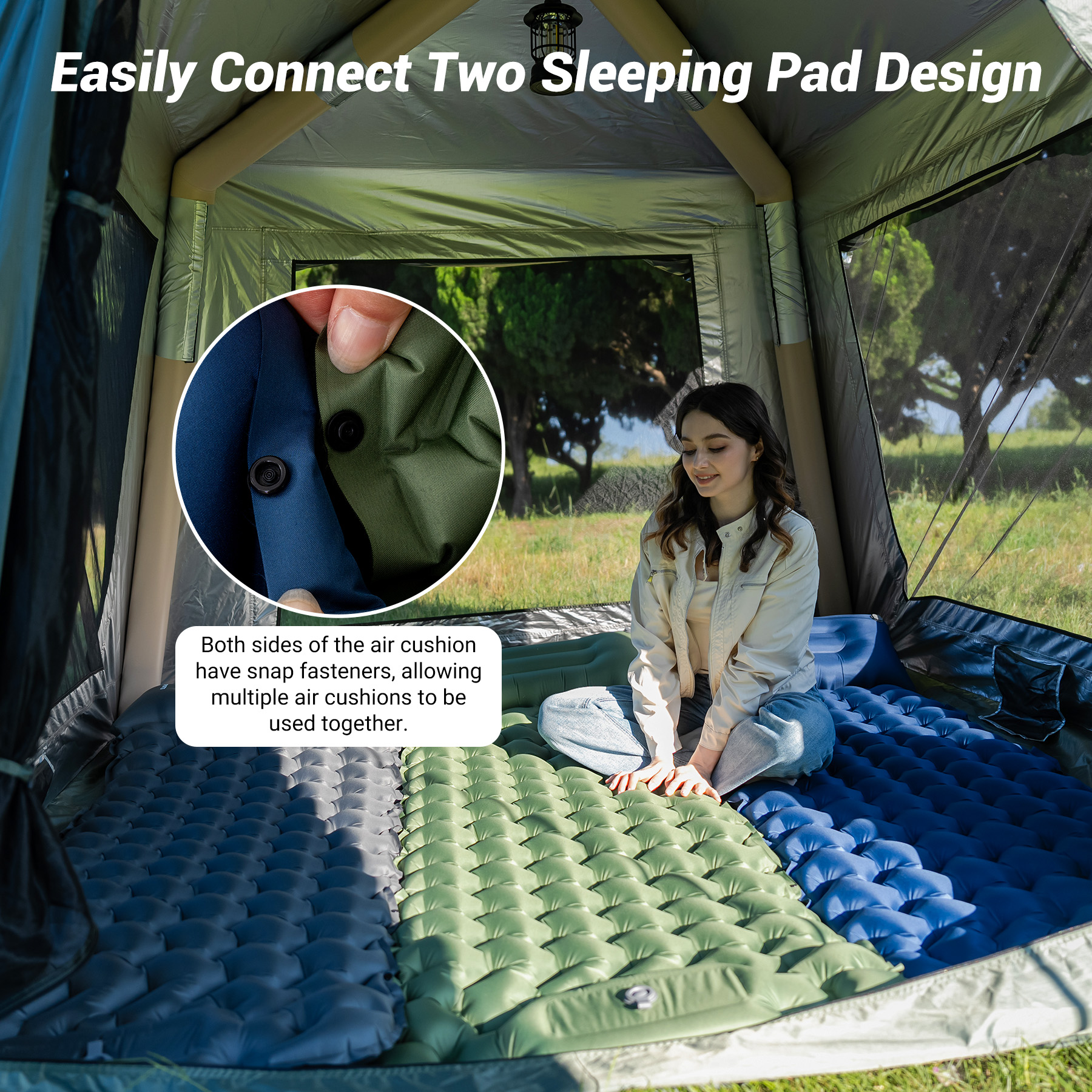 Woman sits on connected blue and green air mattresses inside a tent.