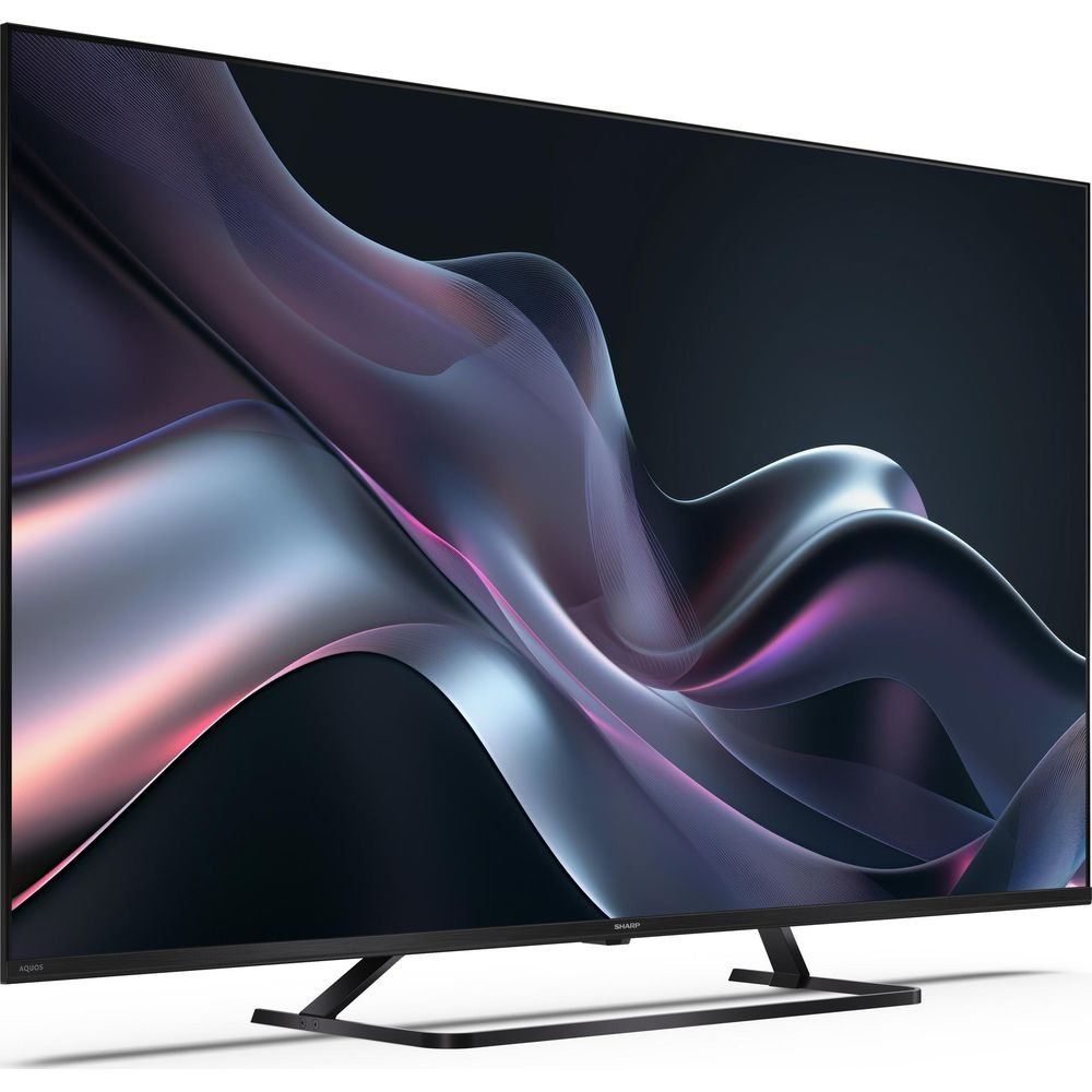 Una TV moderna che mostra uno sfondo astratto e fluido nei toni del viola e dell'argento.