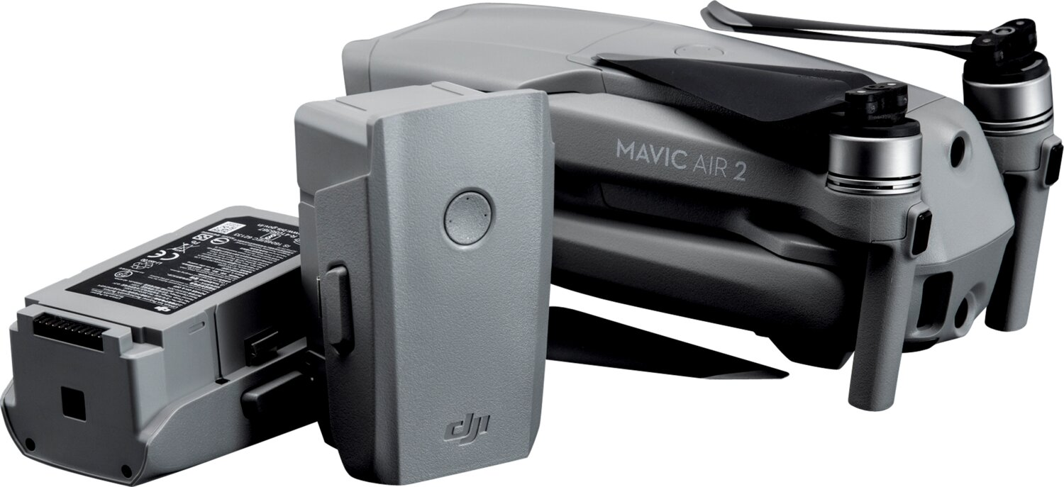 Grauer DJI Mavic Air 2 Drohnenkörper mit zwei Ersatzakkus auf weißem Hintergrund.