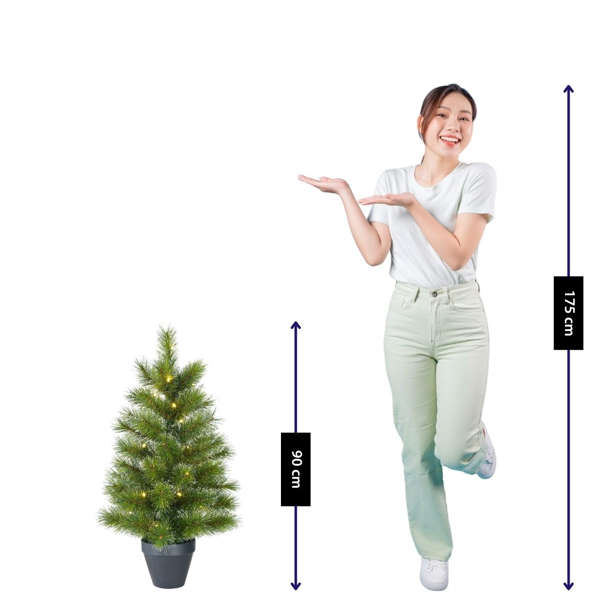 A woman stands next to a 90cm tall, lit Christmas tree. She is 175cm tall.