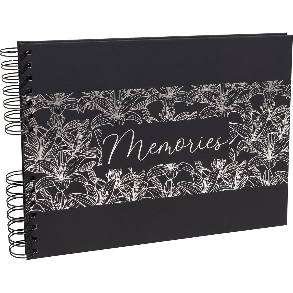 Álbum de recortes negro con diseño floral plateado y la palabra "Memories".