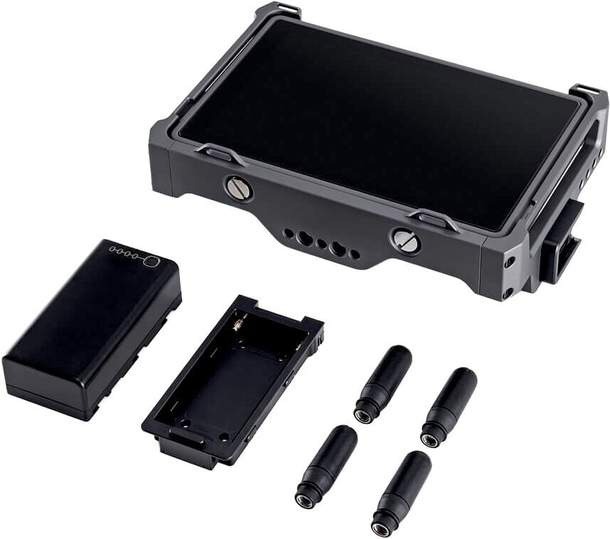 Un moniteur sombre avec accessoires : batterie, support de batterie et antennes.