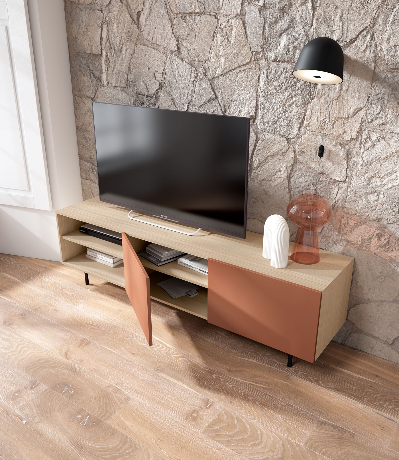 Un mueble de TV moderno con estante abierto y puerta terracota contra pared de piedra.