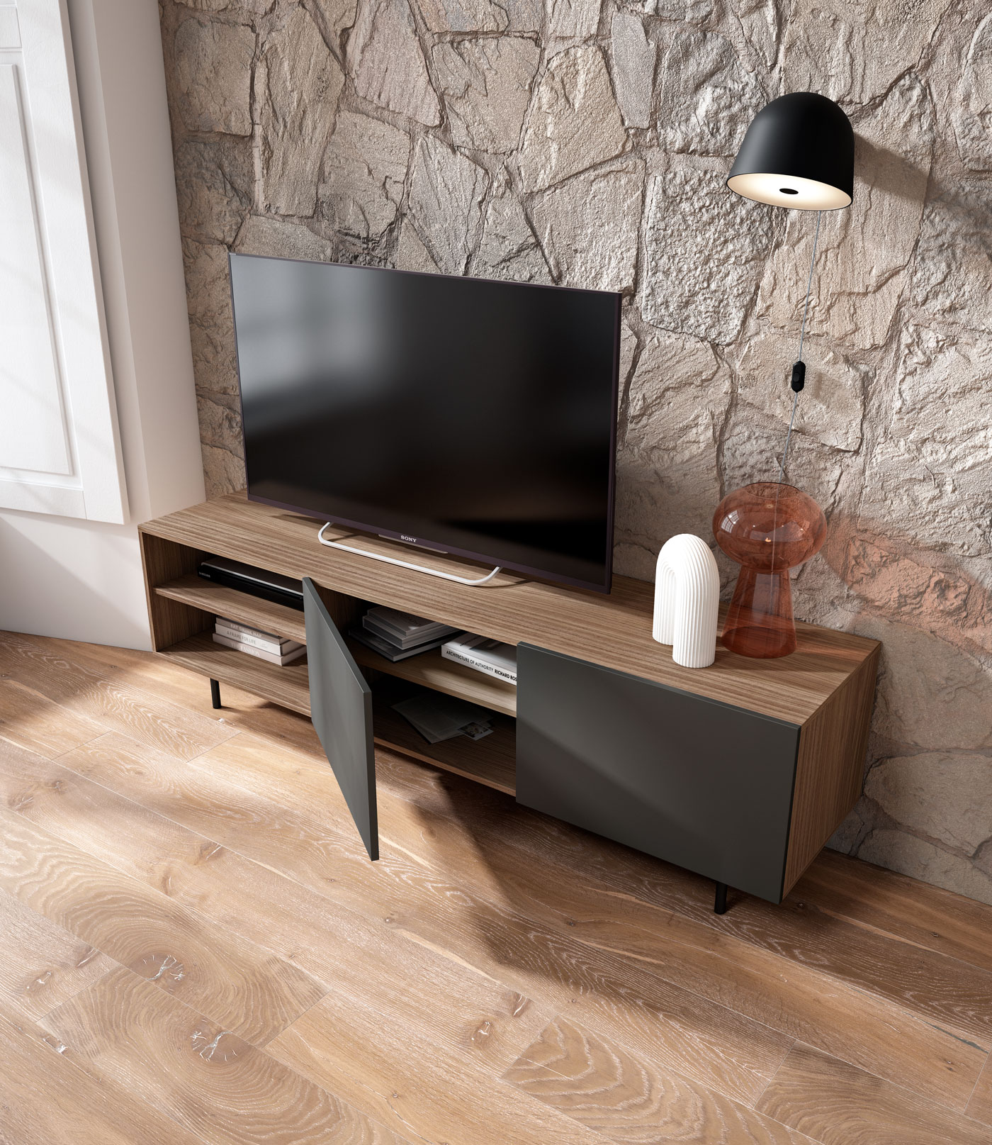 Un mueble de TV de madera moderno contra una pared de piedra.