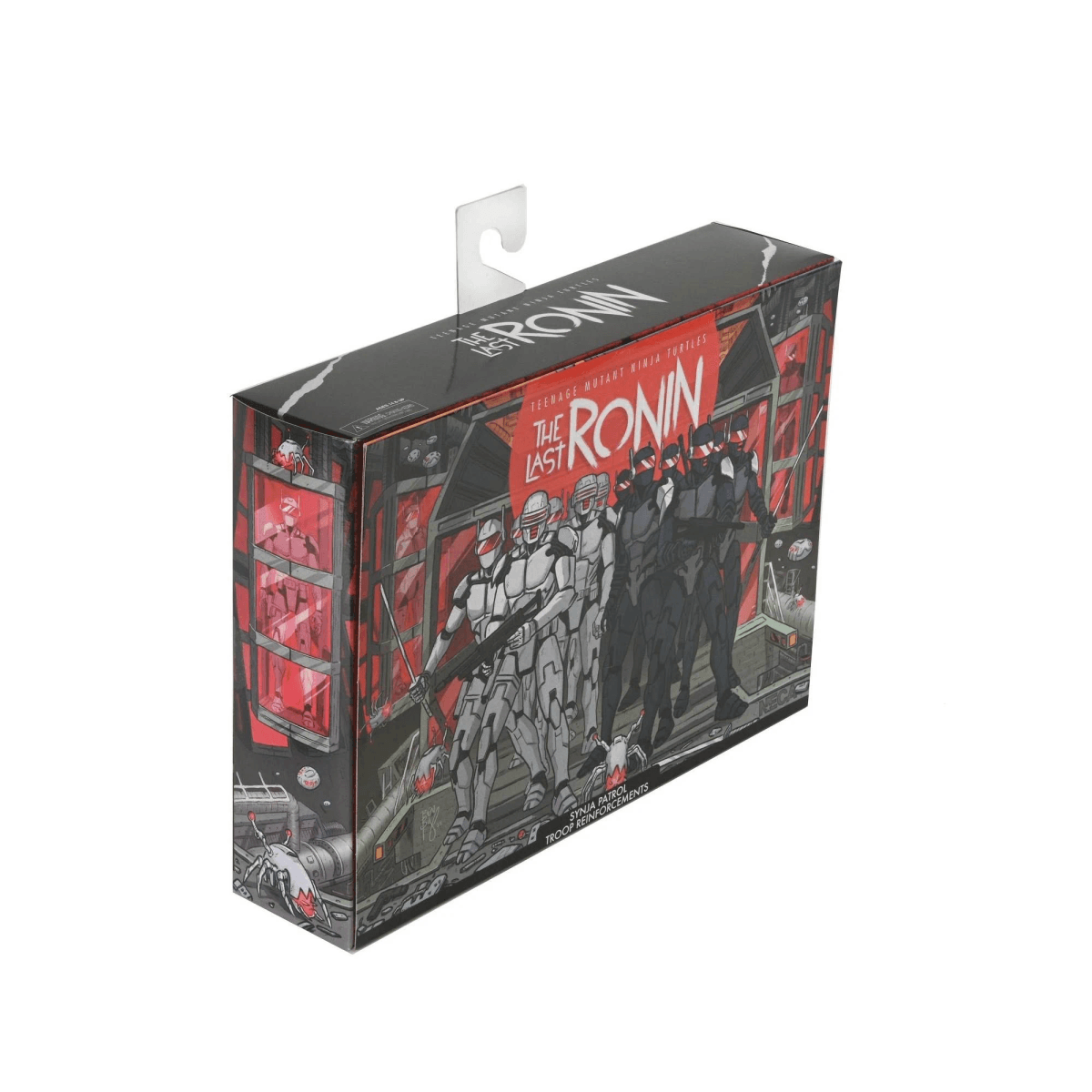 Embalaje de "The Last Ronin" con figuras de cíborg en gris y negro sobre fondo rojo.