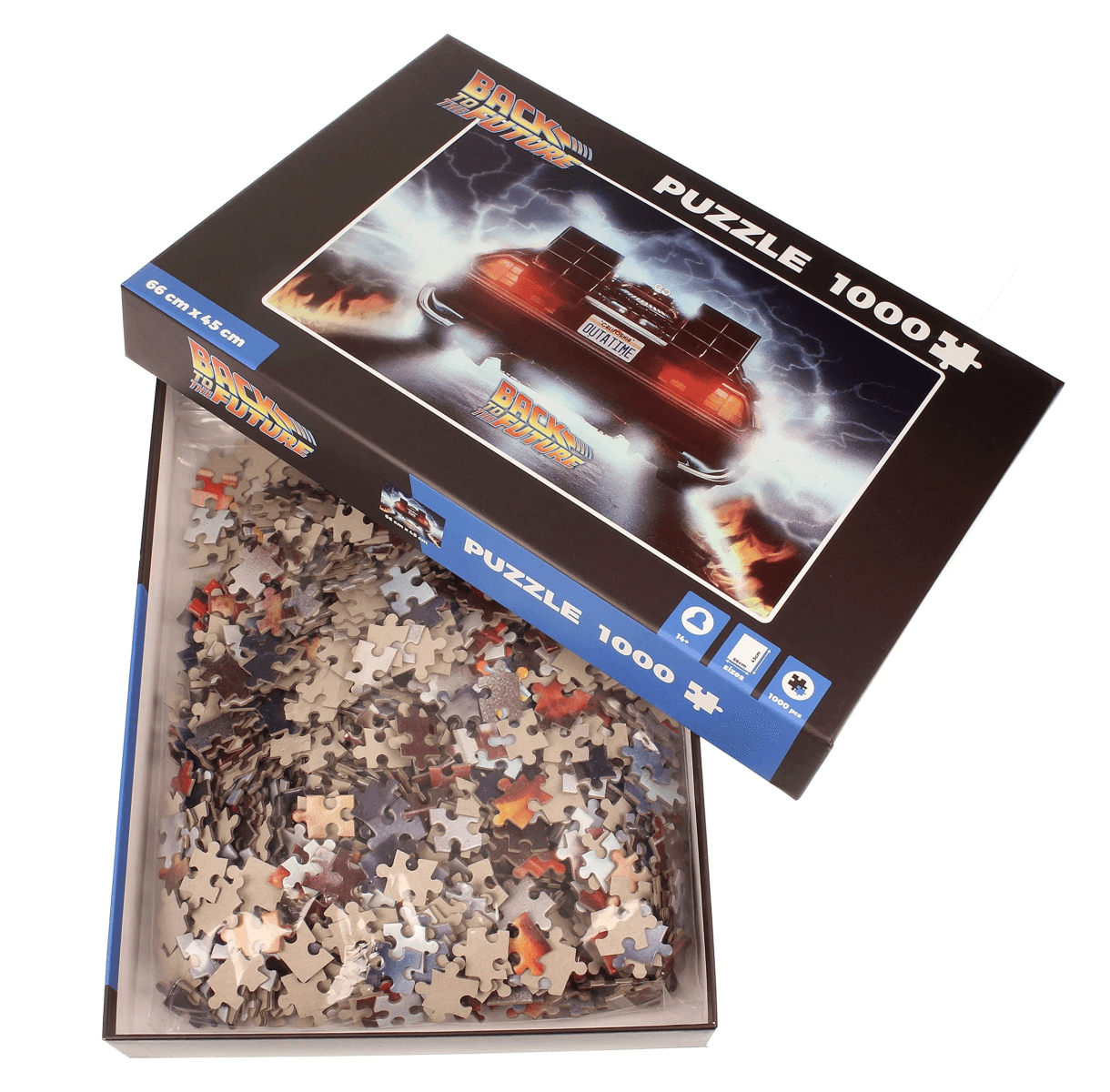 Caja de puzzle Regreso al Futuro con coche DeLorean. Piezas llenan la caja abierta.