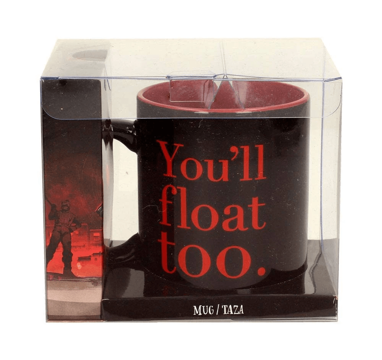 Taza negra con texto rojo "Tú también flotarás" en caja transparente.