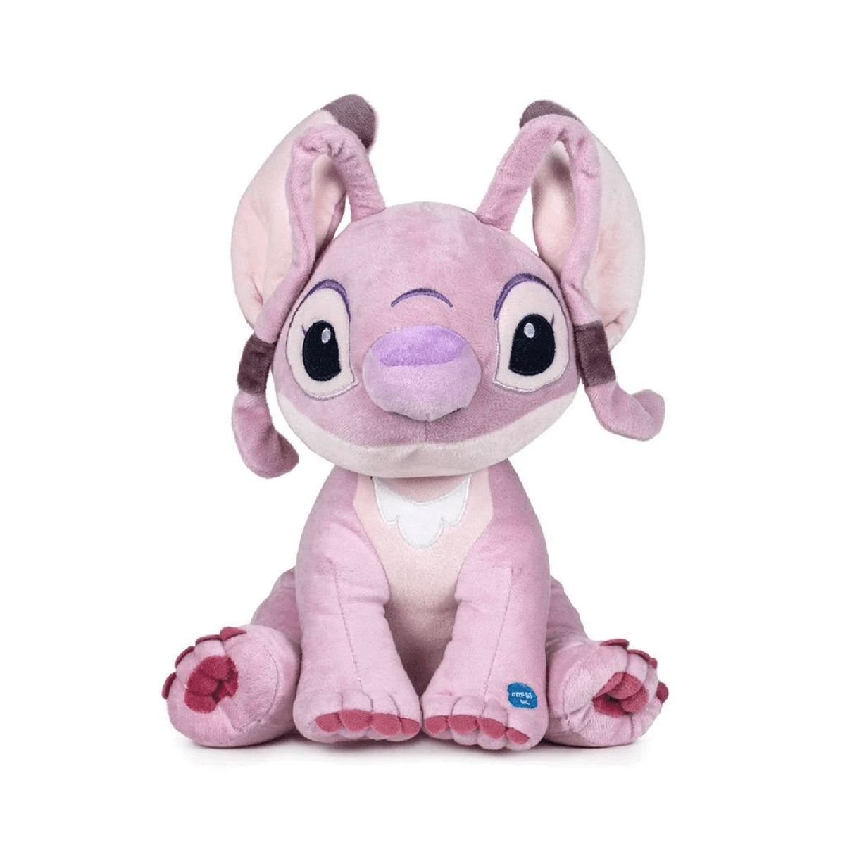 Un peluche rosa con orejas grandes se sienta erguido.