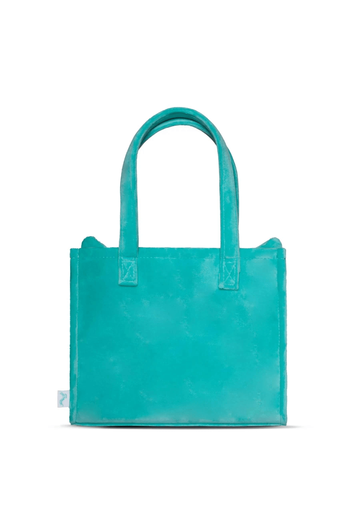 Un pequeño bolso tote de terciopelo turquesa con asas sobre fondo blanco.