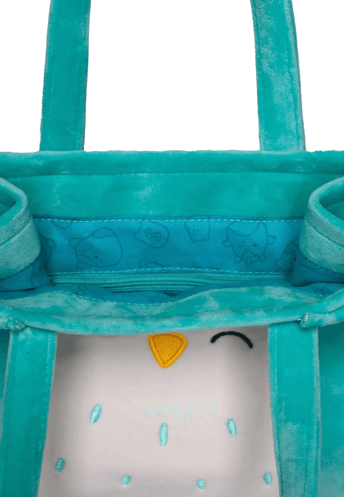 Bolso de felpa turquesa con cara de búho, abierto.