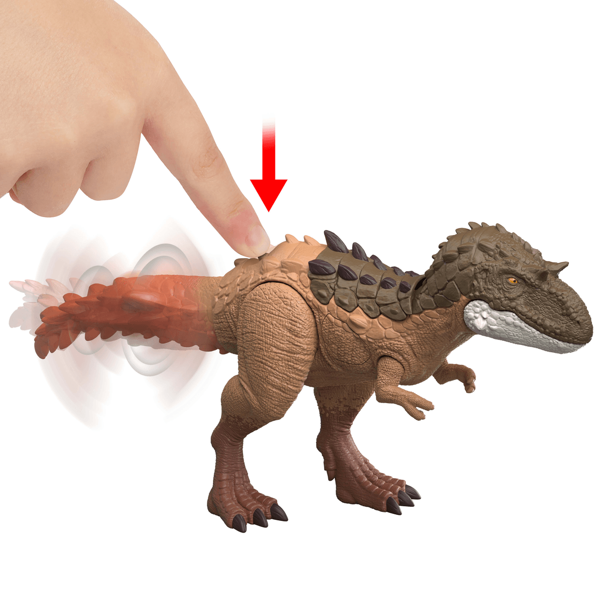 Ein Finger drückt auf den Rücken eines braunen Dinosaurierspielzeugs, dessen Schwanz sich dreht.