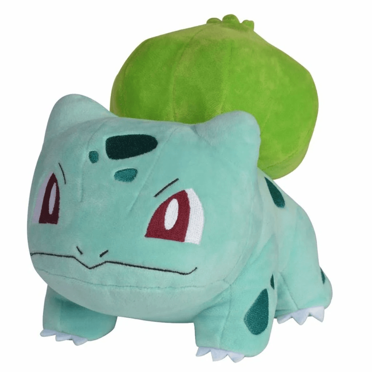 Un peluche verde claro de Bulbasaur con ojos rojos y un gran bulbo verde en su espalda.