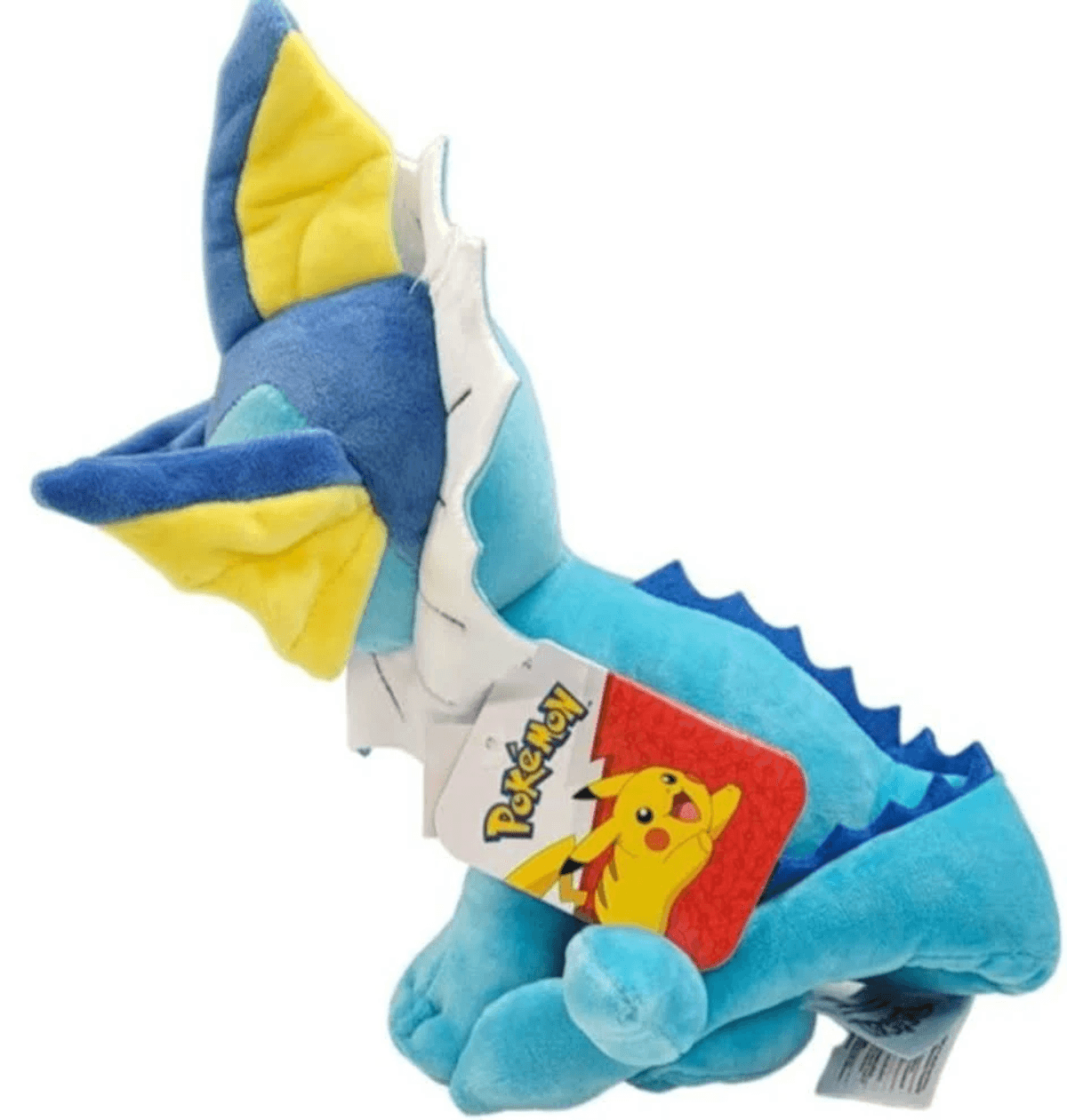 Un peluche Vaporeon azul con aletas amarillas y etiqueta Pokémon con Pikachu.