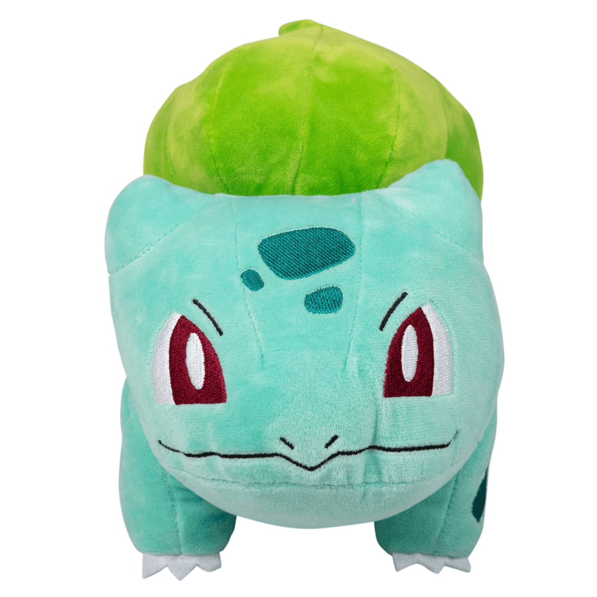 Un Bulbasaur de peluche verde claro con una gran bombilla verde en la espalda.
