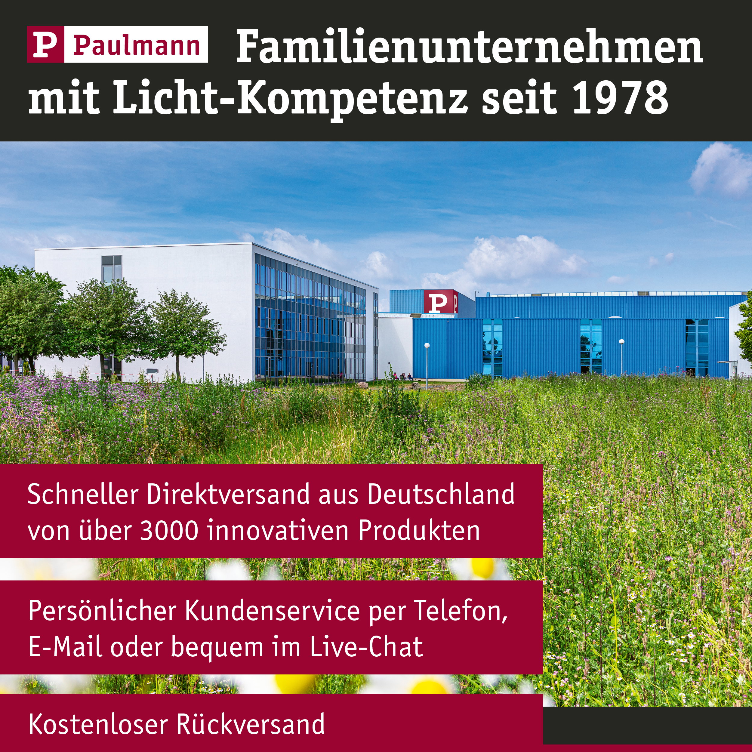 Paulmann Firmengebäude mit blauem und weißem Teil, umgeben von Grün.