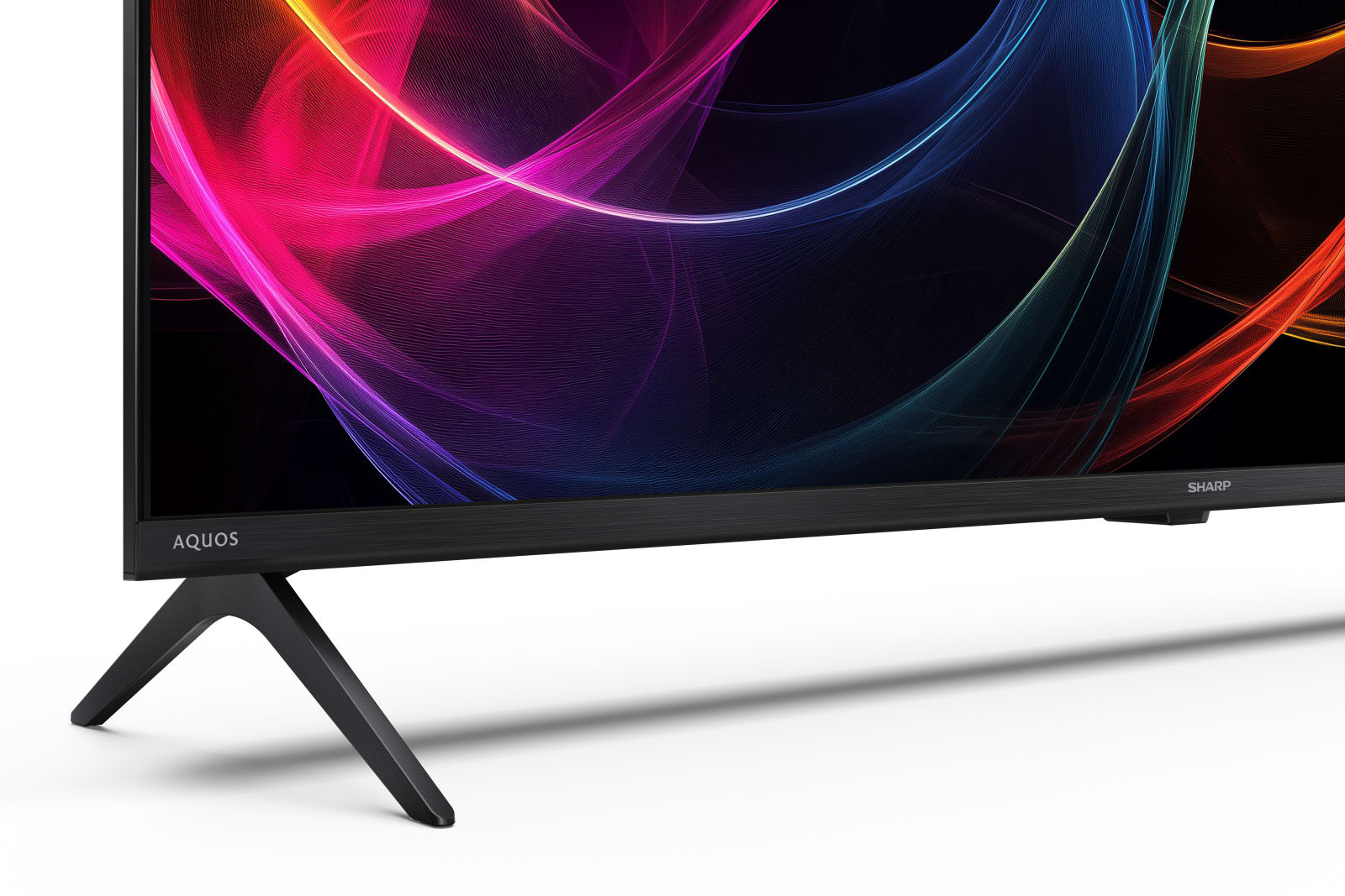 Una TV moderna con schermo colorato astratto e due piedini in primo piano.