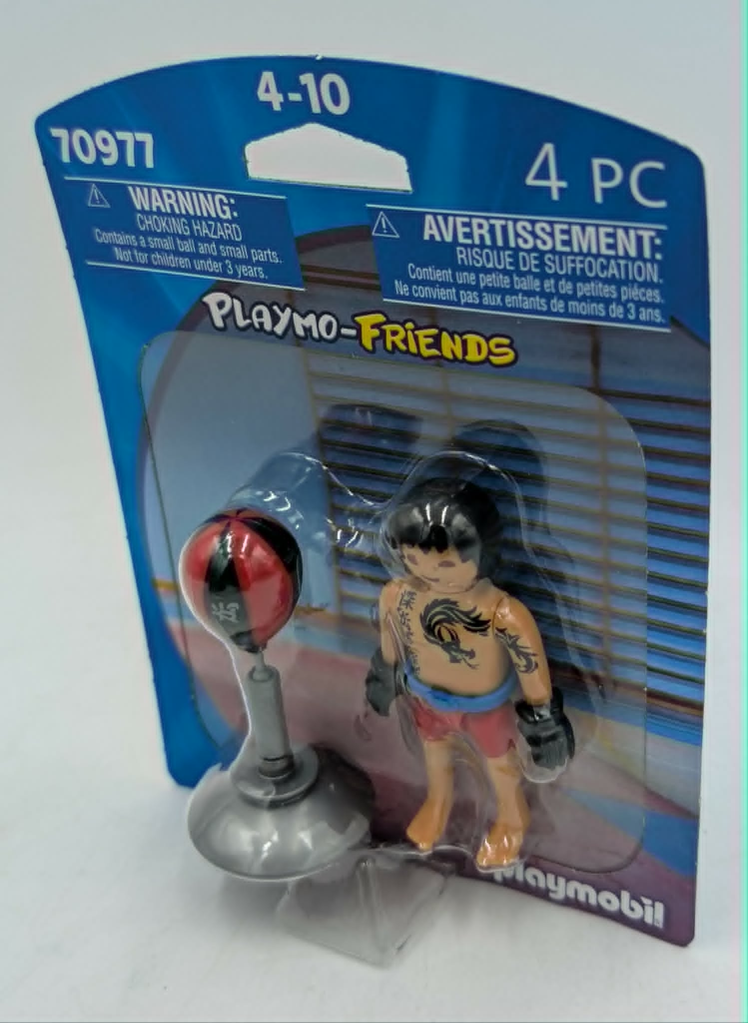 Figurka Playmobil wojownika z workiem treningowym na opakowaniu.