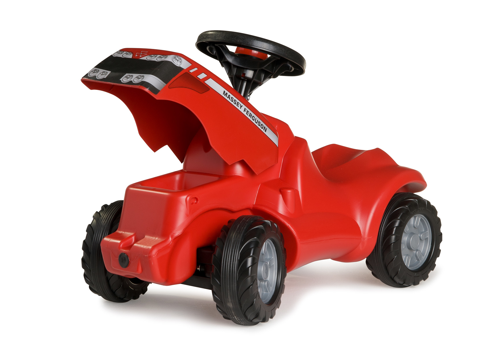 Ein rotes Spielzeugtraktor mit schwarzem Lenkrad und Aufklebern.