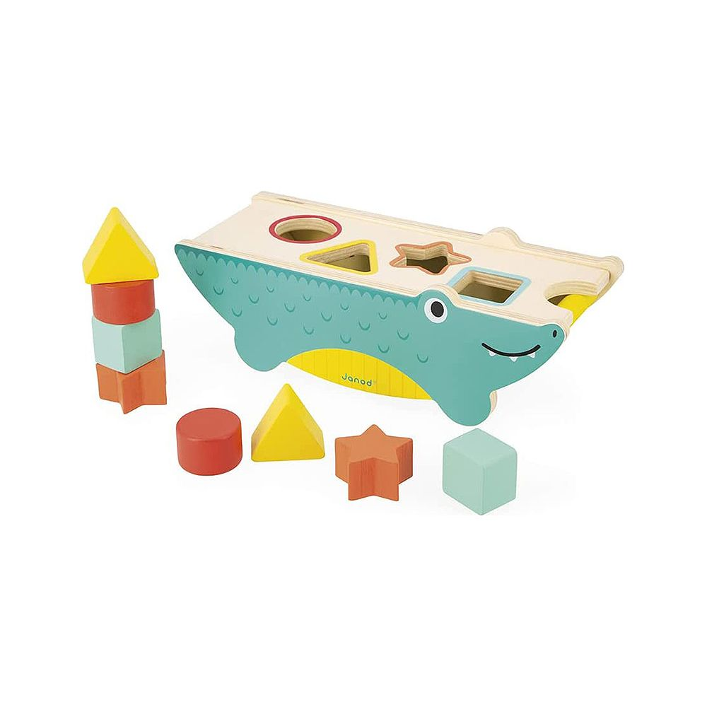 Un jouet en bois en forme de crocodile avec des encoches de tri et des blocs colorés.