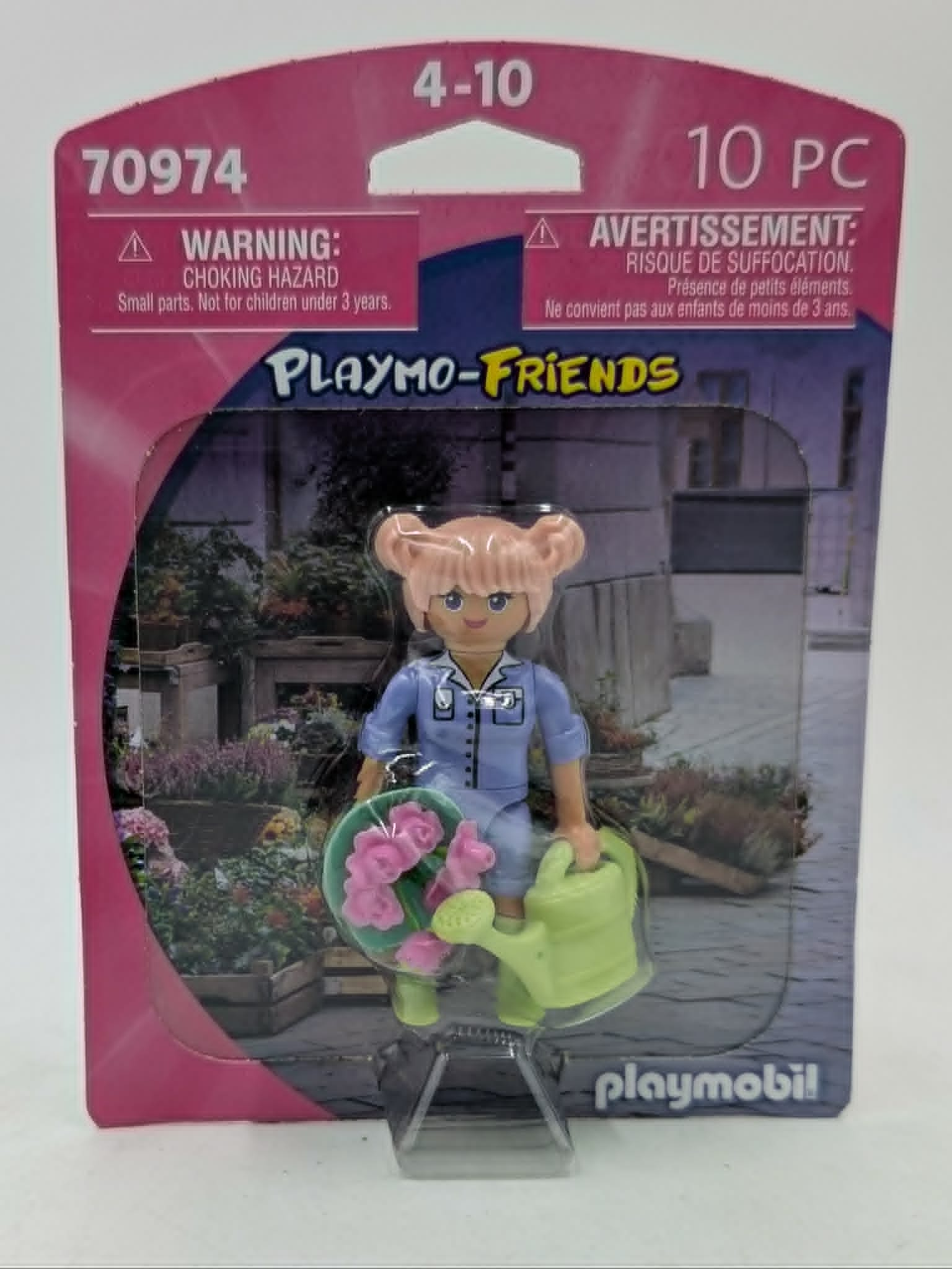 Playmobil-Figur mit Blumen und Gießkanne in Verpackung.