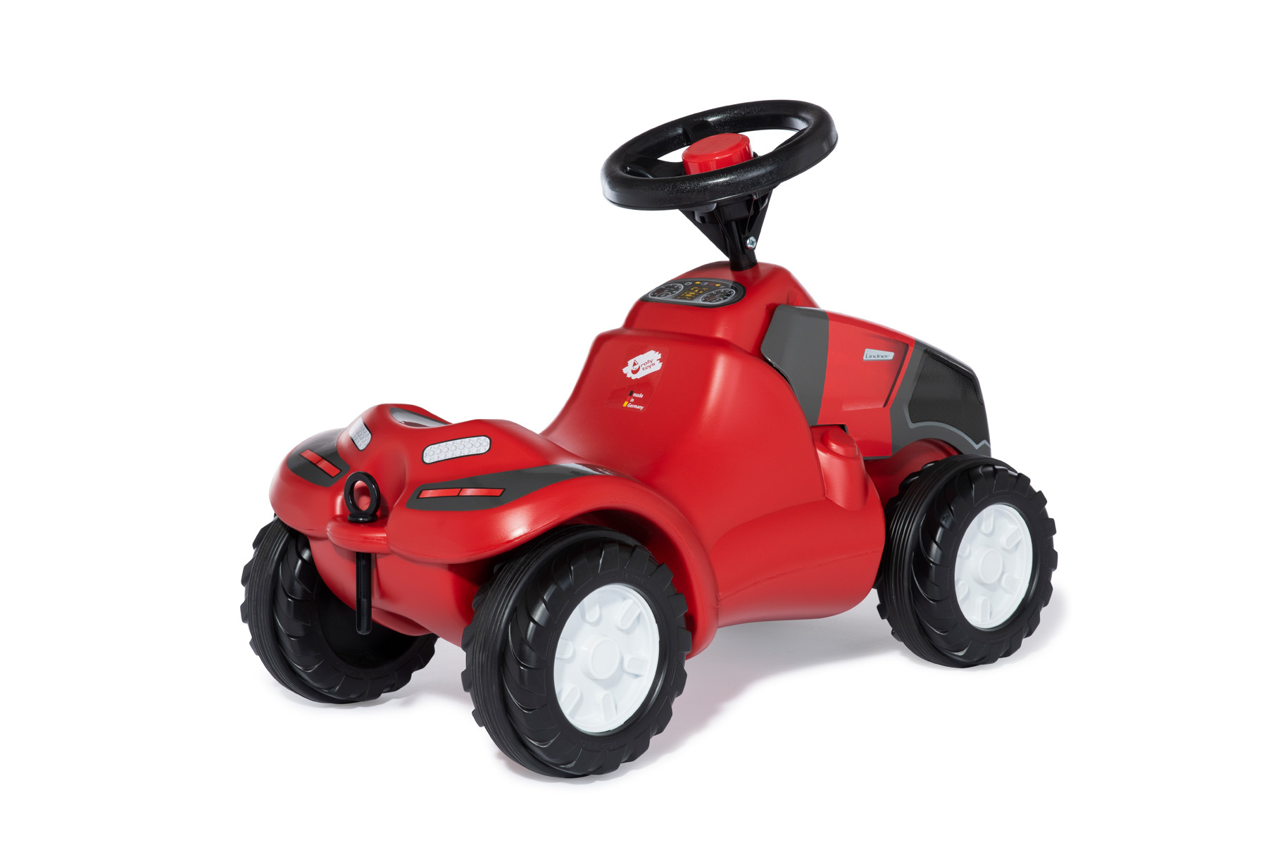 Un'auto giocattolo rossa con volante nero e ruote grandi.