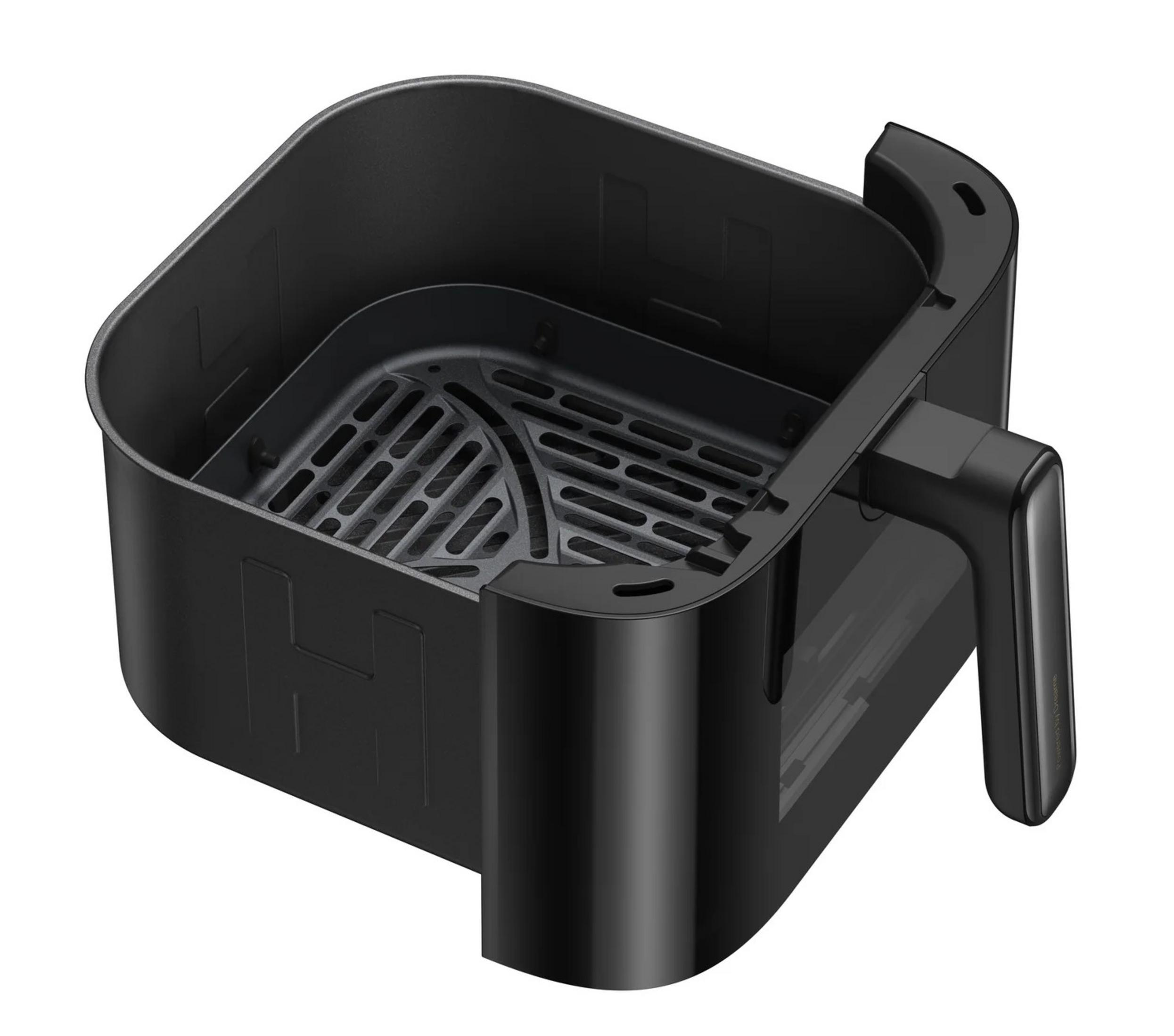 Cestello nero e vuoto per friggitrice ad aria con manico e inserto forato.