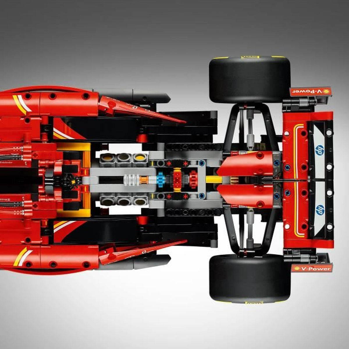 Vista superior de un modelo de coche de carreras de Lego Fórmula 1 rojo con ruedas negras.