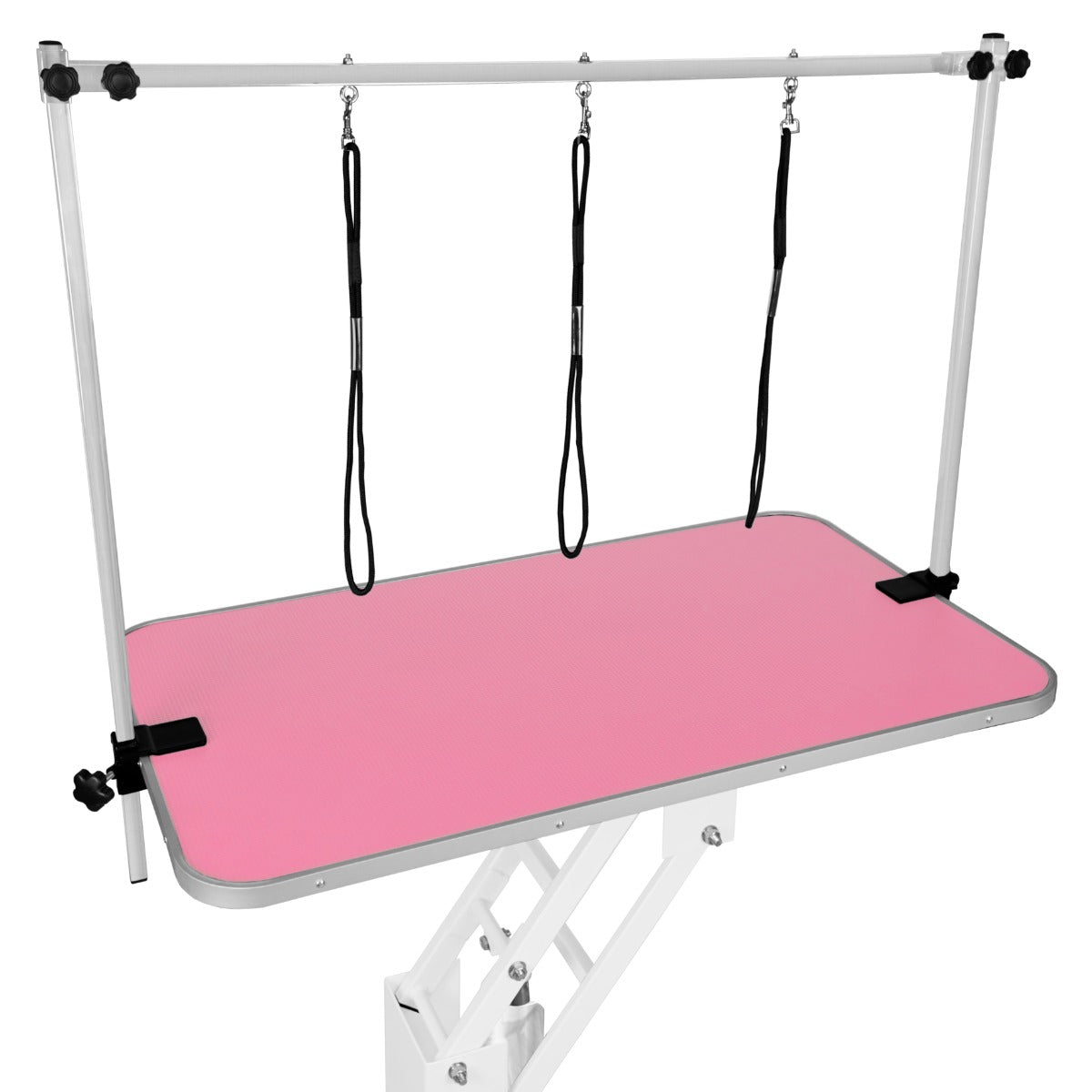 Una mesa de aseo rosa con altura regulable y tres correas.