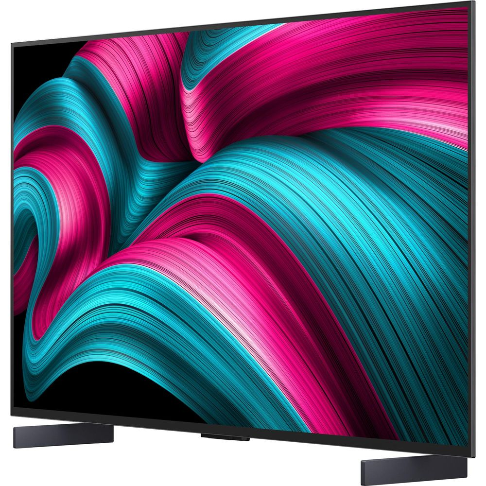 Un televisore moderno con uno schermo che mostra un motivo astratto di onde rosa e turchesi.