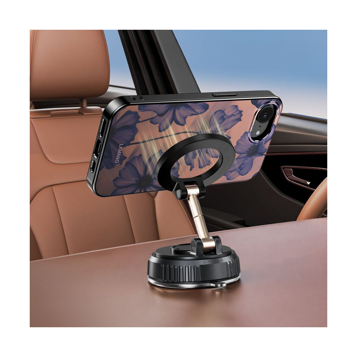 Ein Handyhalter mit Blumenmuster in einem Auto auf dem Armaturenbrett.
