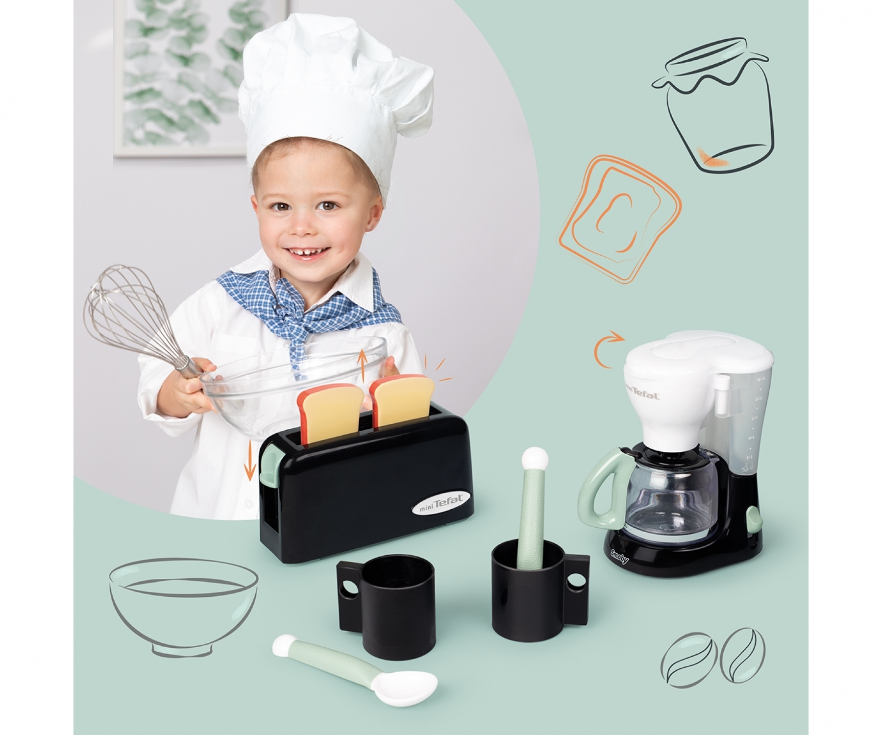 Ein Junge mit Kochmütze hält eine Schüssel mit Toast in einem Toaster. Spielzeug-Kaffeemaschine daneben.