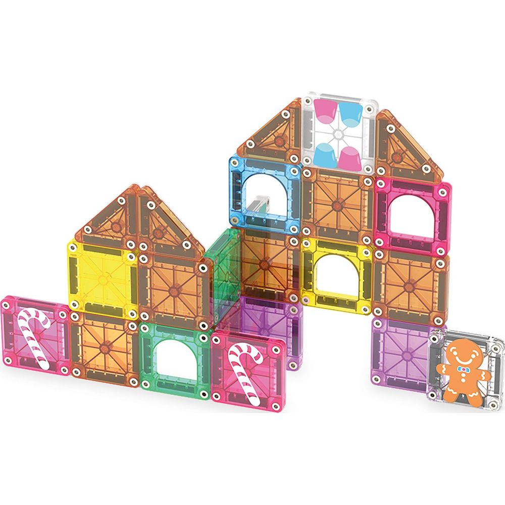 Bunte Magnetbausteine bilden ein Haus mit Lebkuchenmann und Zuckerstangen.