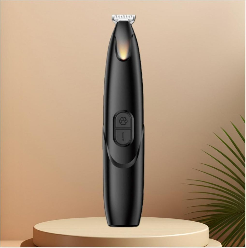 Schwarzer Trimmer mit Pfotenmotiv-Taste auf einem Sockel, mit Pflanzen im Hintergrund.