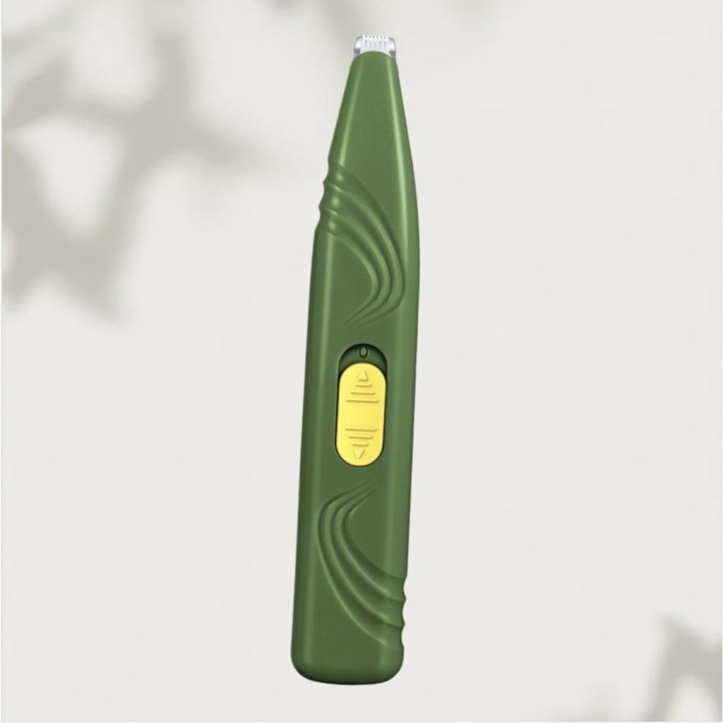 Grüner Trimmer mit gelbem Schalter, detailliert. Schatten im Hintergrund.