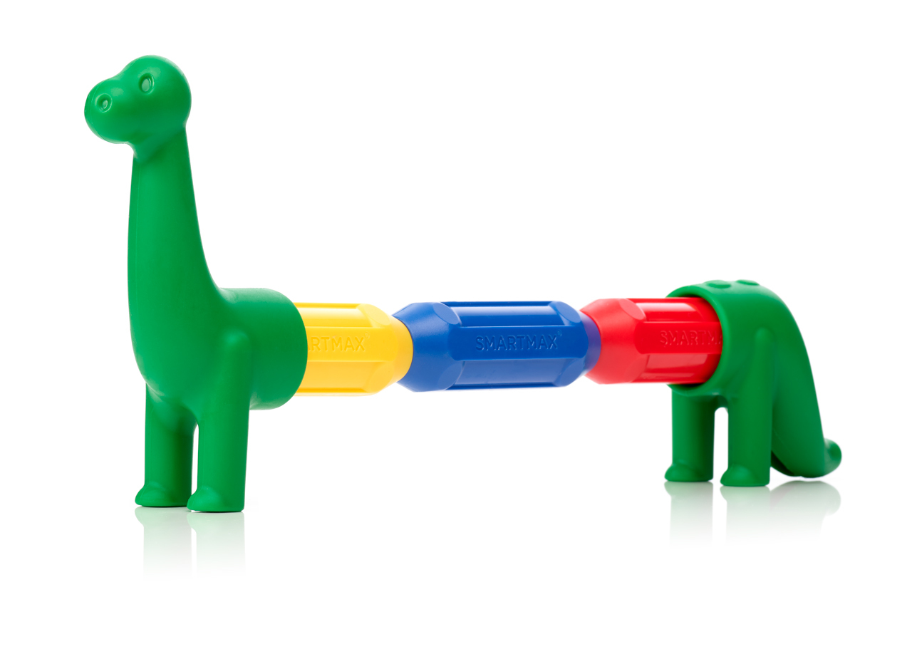 Un dinosaurio de juguete verde hecho de piezas magnéticas conectadas en amarillo, azul y rojo.