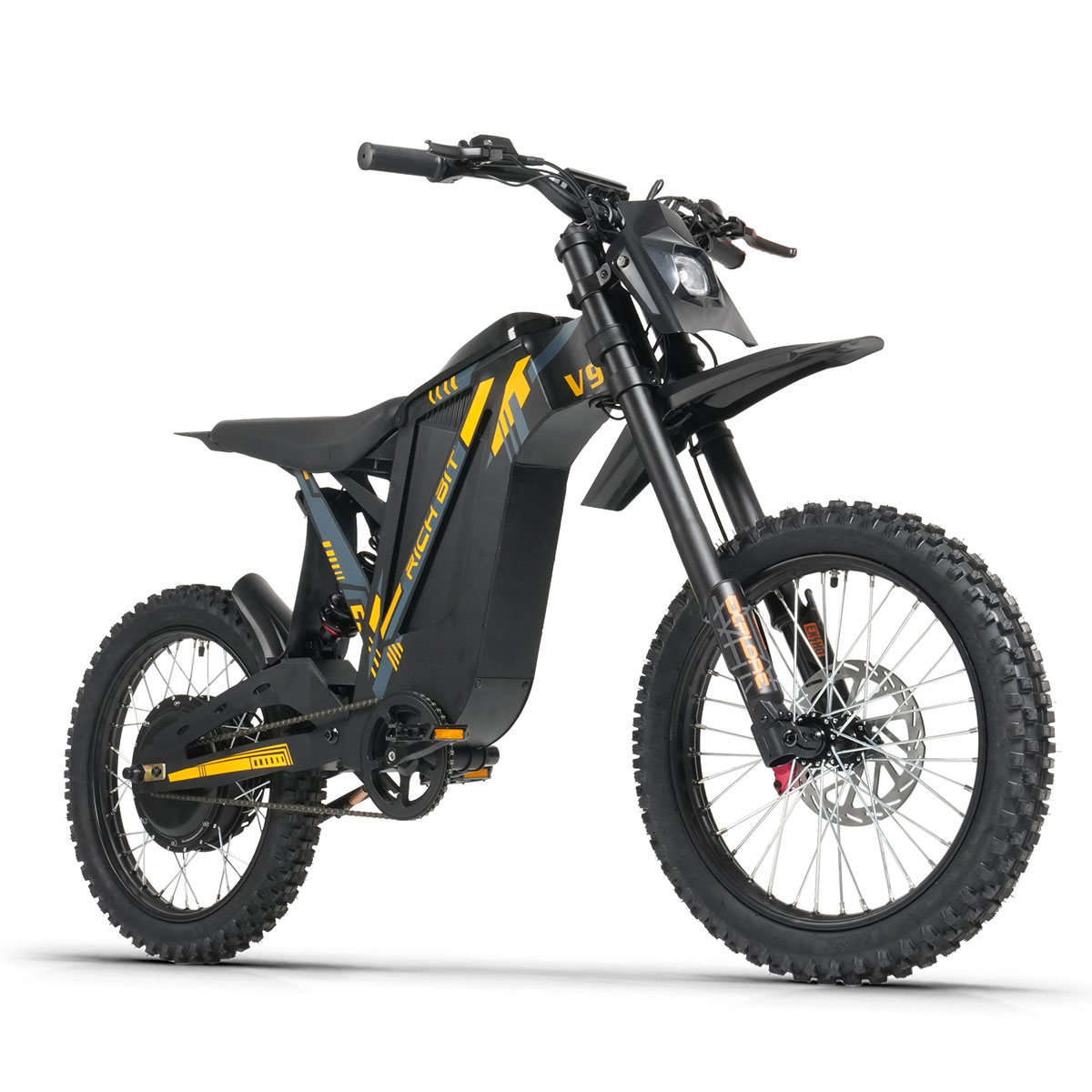 Ein schwarzes E-Bike mit gelben Akzenten, grobstolligen Reifen und Federung.