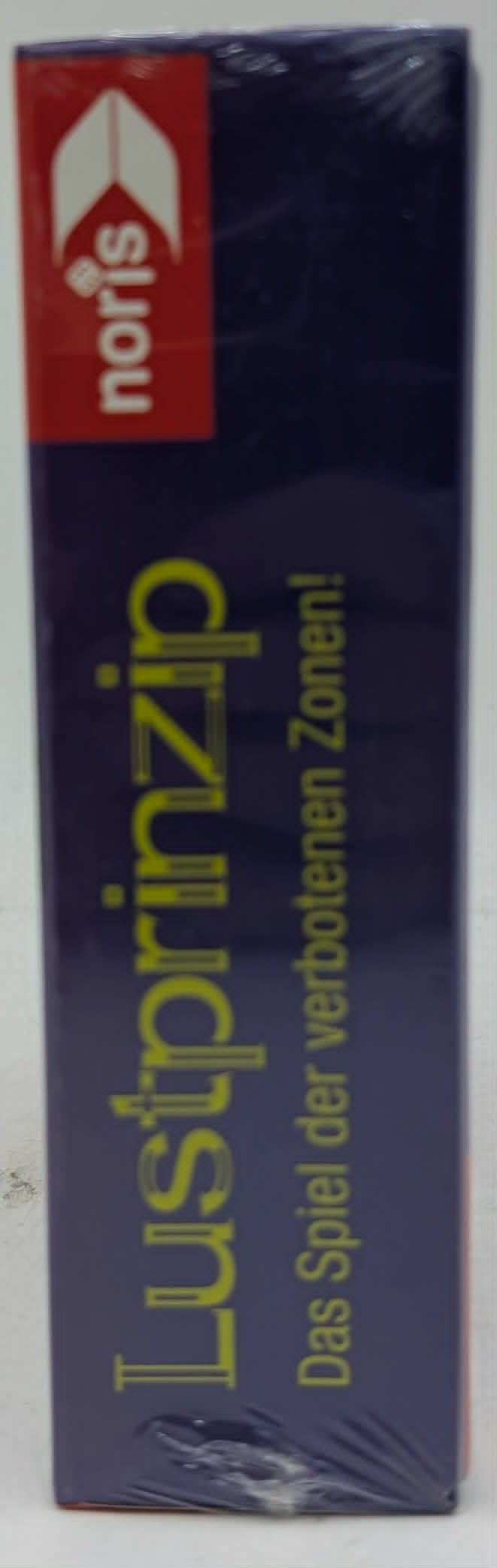 Lustprinzip Spiel der verbotenen Zonen, Noris Logo auf lila Box.