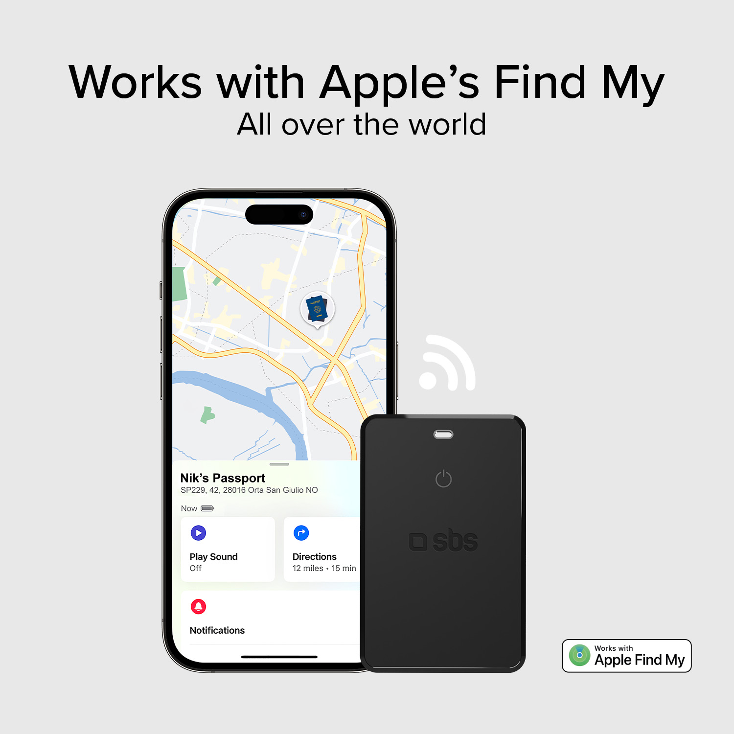 Un rastreador negro junto a un iPhone que muestra la app Buscar.