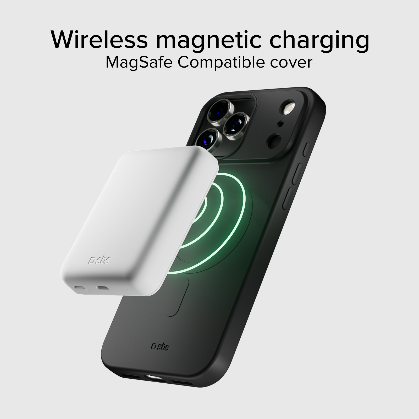Cargador MagSafe blanco se acopla a un iPhone negro con indicador de carga verde.