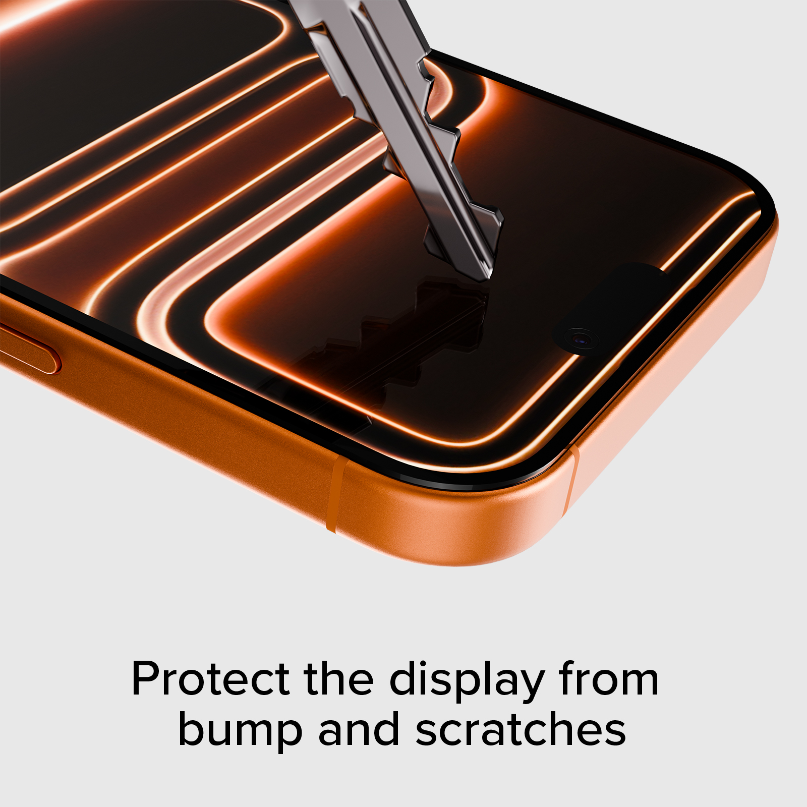 Ein Schlüssel kratzt über das Display eines orangefarbenen Telefons.