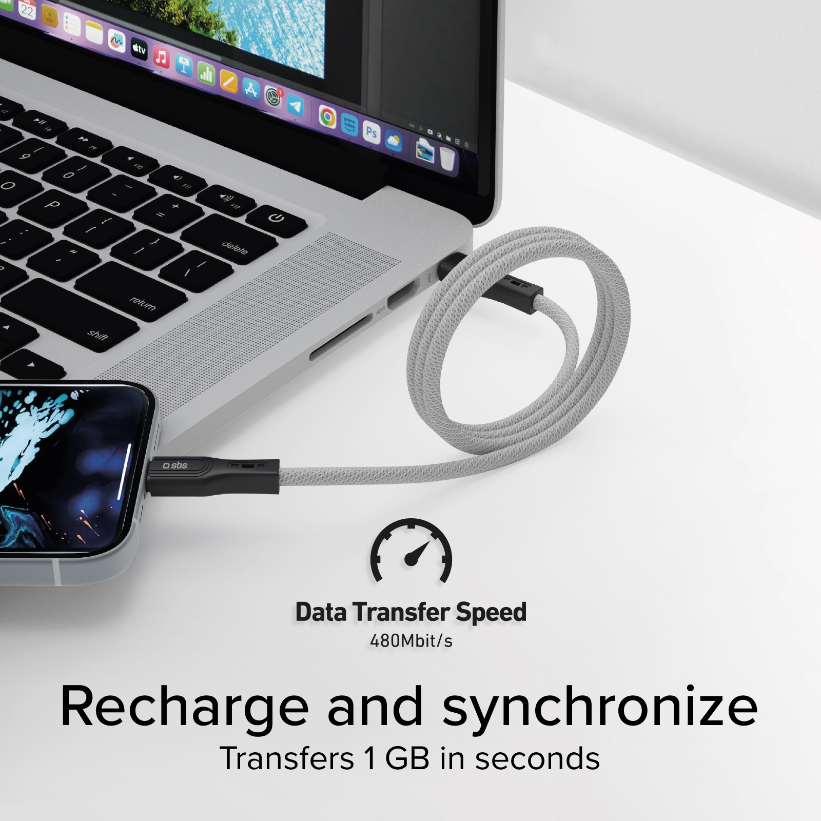 Un iPhone se conecta a un portátil mediante un cable USB gris. Velocidad de transferencia.