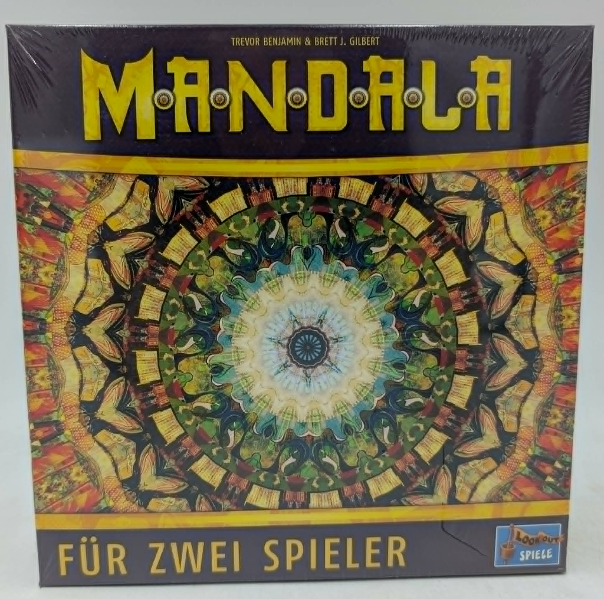 Brettspiel-Box "Mandala" für zwei Spieler mit buntem Mandala-Muster.
