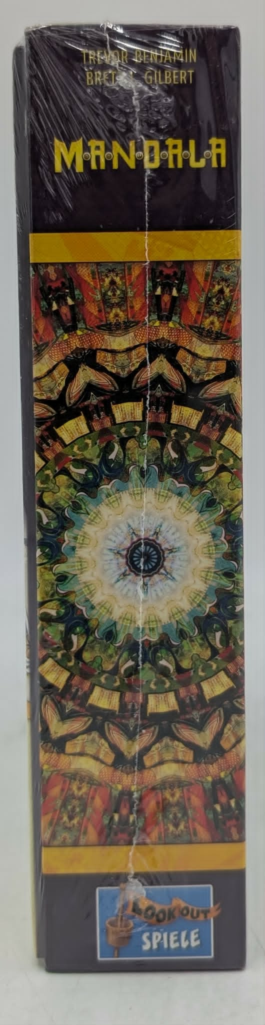 Schachtel des Brettspiels Mandala mit farbenfrohem Muster und Spielernamen.