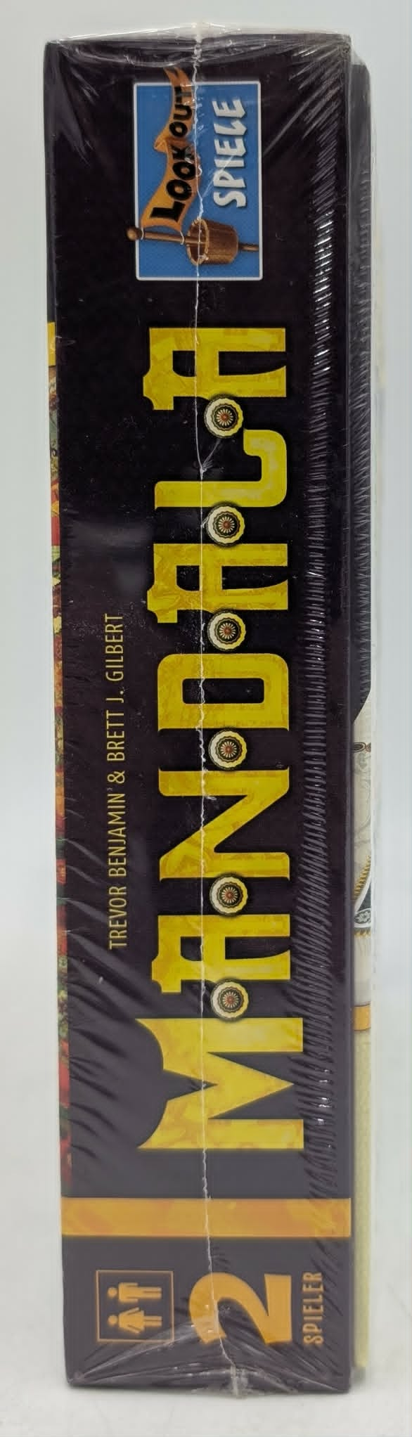 Brettspiel-Schachtel mit gelbem Text "MINDNIGHT" und "Lookout Spiele" Logo.