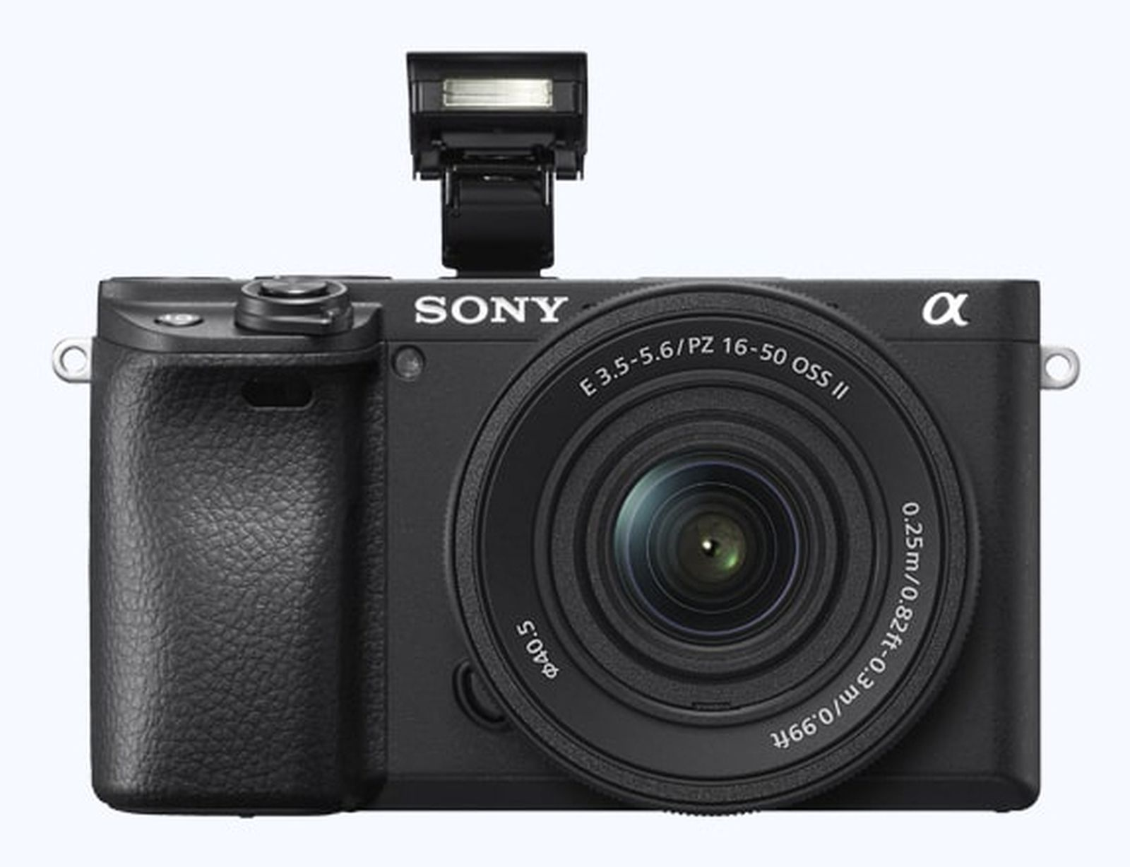Fotocamera Sony Alpha nera con flash a comparsa e obiettivo.
